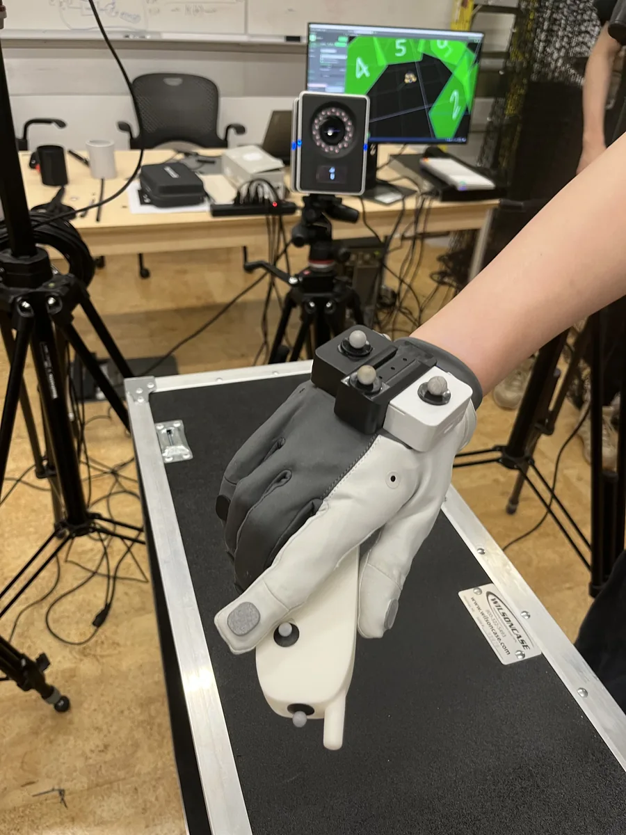 MANUS data glove with motion-capture markers